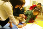 students and teacher playing a game